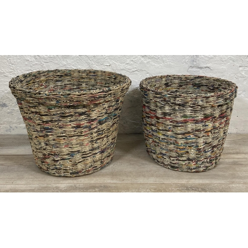 142 - Two handmade woven newspaper waste paper bins - largest approx. 33cm high x 43cm diameter