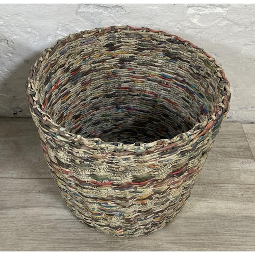 142 - Two handmade woven newspaper waste paper bins - largest approx. 33cm high x 43cm diameter