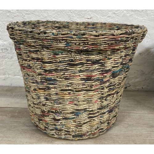 142 - Two handmade woven newspaper waste paper bins - largest approx. 33cm high x 43cm diameter