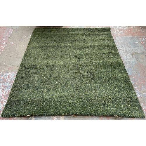 148 - An IKEA Vindum green shag pile rug - approx. 270cm x 200cm