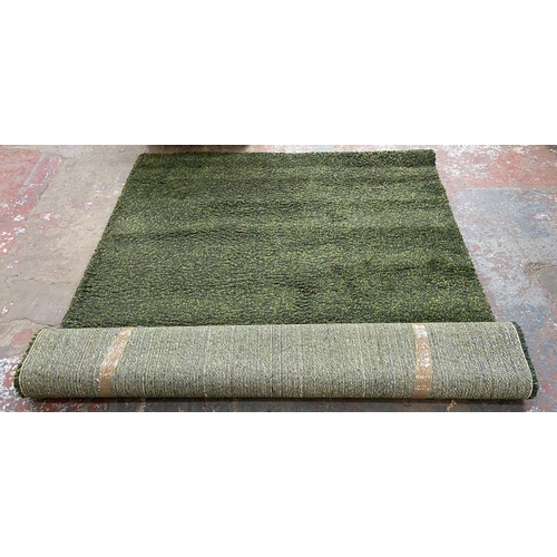 148 - An IKEA Vindum green shag pile rug - approx. 270cm x 200cm