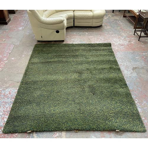 148 - An IKEA Vindum green shag pile rug - approx. 270cm x 200cm