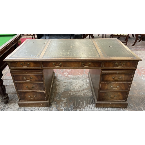 149 - A Bevan Funnell Ltd. Reprodux Victorian style twin pedestal mahogany desk with seven drawers and gre... 