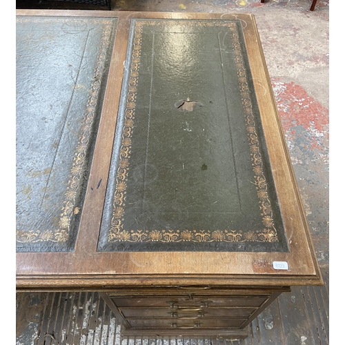 149 - A Bevan Funnell Ltd. Reprodux Victorian style twin pedestal mahogany desk with seven drawers and gre... 