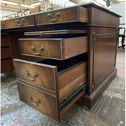 149 - A Bevan Funnell Ltd. Reprodux Victorian style twin pedestal mahogany desk with seven drawers and gre... 