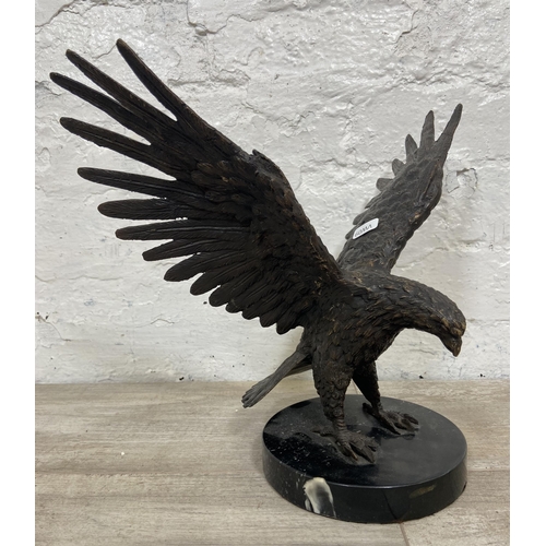 15 - A bronze sculpture of an eagle on marble plinth - approx. 28cm high x 34cm wide