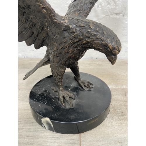 15 - A bronze sculpture of an eagle on marble plinth - approx. 28cm high x 34cm wide