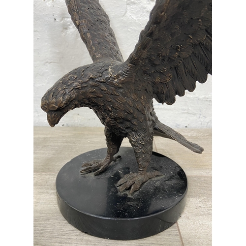 15 - A bronze sculpture of an eagle on marble plinth - approx. 28cm high x 34cm wide