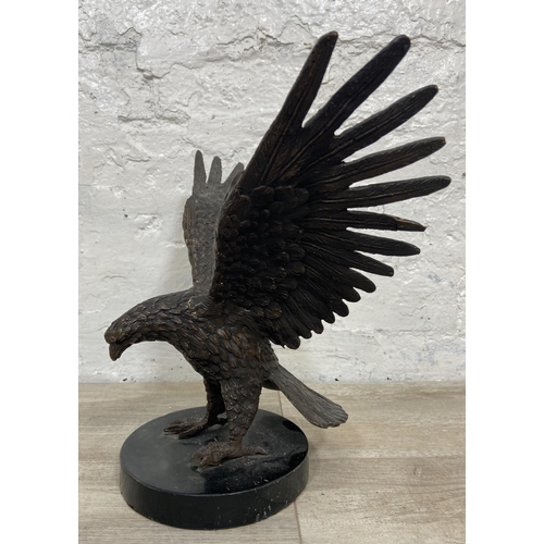 15 - A bronze sculpture of an eagle on marble plinth - approx. 28cm high x 34cm wide