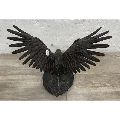 15 - A bronze sculpture of an eagle on marble plinth - approx. 28cm high x 34cm wide