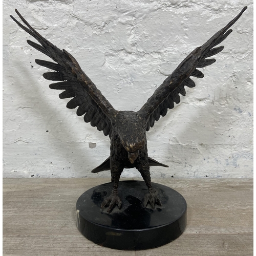 15 - A bronze sculpture of an eagle on marble plinth - approx. 28cm high x 34cm wide