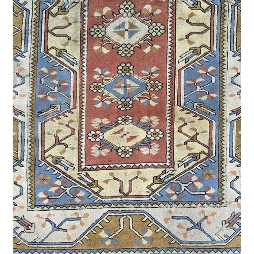 151 - A vintage machine woven multi-coloured rug