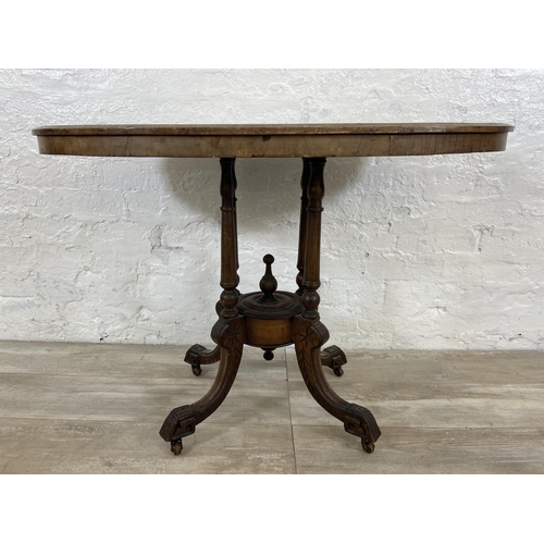 156 - A Victorian walnut and mahogany oval hall table on quatrefoil pedestal base - approx. 67cm high x 98... 