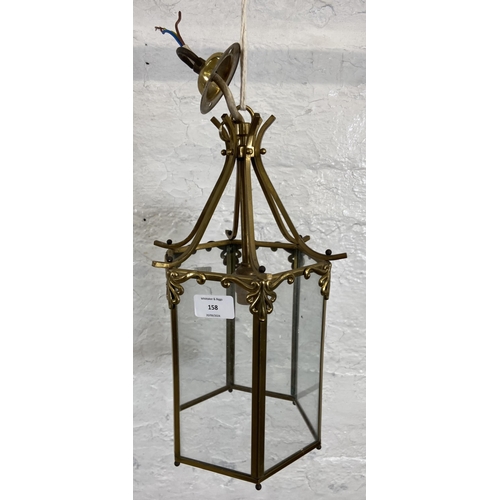 158 - A mid/late 20th century Georgian style hexagonal brass and glass ceiling lantern - approx. 35cm high... 