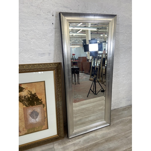 160 - Two items, one modern silver painted bevelled edge rectangular wall mirror and one gilt framed leaf ... 