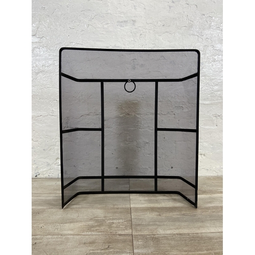 17 - A black metal meshed fireguard - approx. 71cm high x 61cm wide x 17cm deep