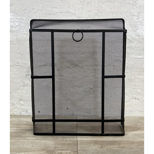 17 - A black metal meshed fireguard - approx. 71cm high x 61cm wide x 17cm deep