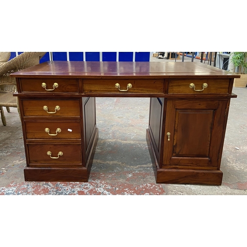 171 - A Victorian style hardwood twin pedestal desk with one cupboard door and six drawers - approx. 74.5c... 