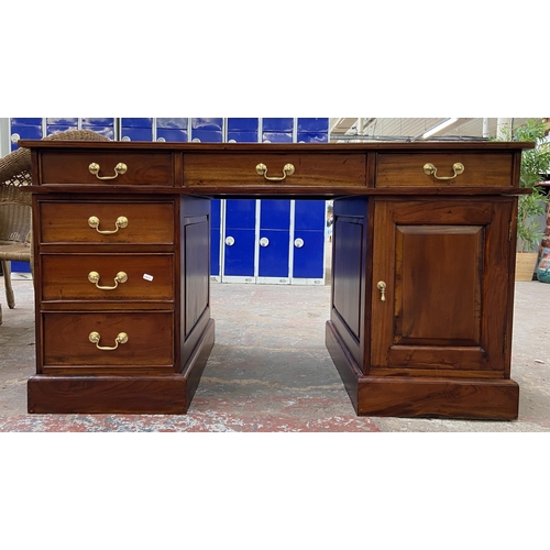 171 - A Victorian style hardwood twin pedestal desk with one cupboard door and six drawers - approx. 74.5c... 