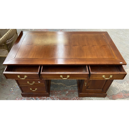 171 - A Victorian style hardwood twin pedestal desk with one cupboard door and six drawers - approx. 74.5c... 