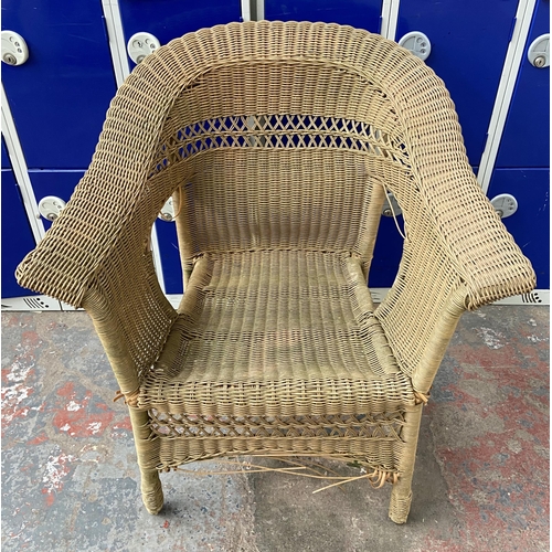 184 - A circular wicker two tier conservatory table with four chairs