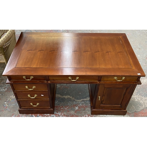 171 - A Victorian style hardwood twin pedestal desk with one cupboard door and six drawers - approx. 74.5c... 