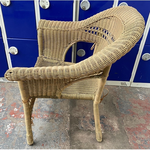 184 - A circular wicker two tier conservatory table with four chairs