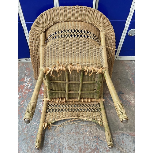 184 - A circular wicker two tier conservatory table with four chairs