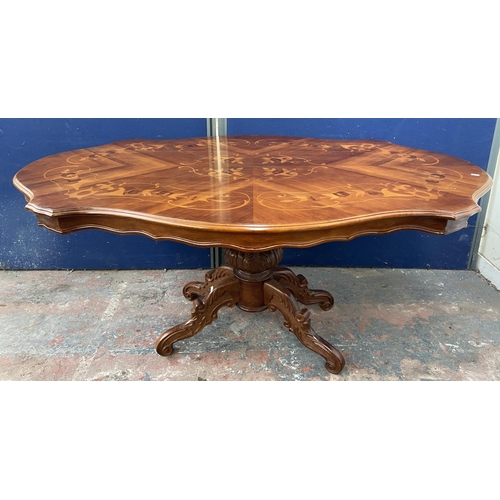 176 - An Italian style inlaid walnut single pedestal dining table and six fabric upholstered chairs