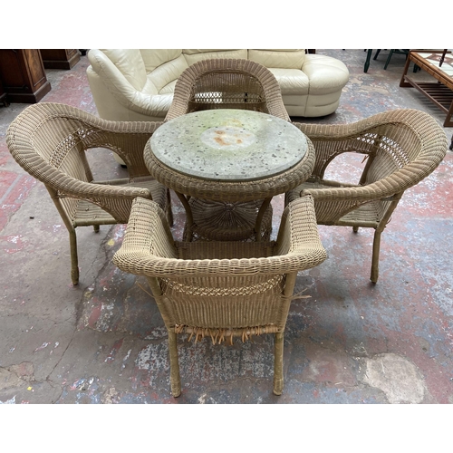 184 - A circular wicker two tier conservatory table with four chairs