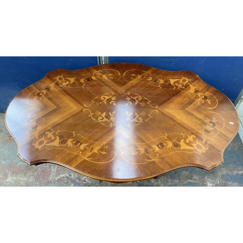 176 - An Italian style inlaid walnut single pedestal dining table and six fabric upholstered chairs