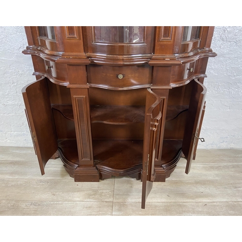 179 - An Italian style inlaid mahogany bow fronted display cabinet with three lower cupboard doors, three ... 