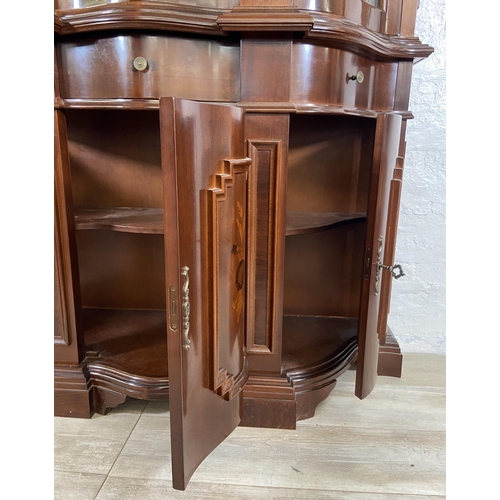 179 - An Italian style inlaid mahogany bow fronted display cabinet with three lower cupboard doors, three ... 