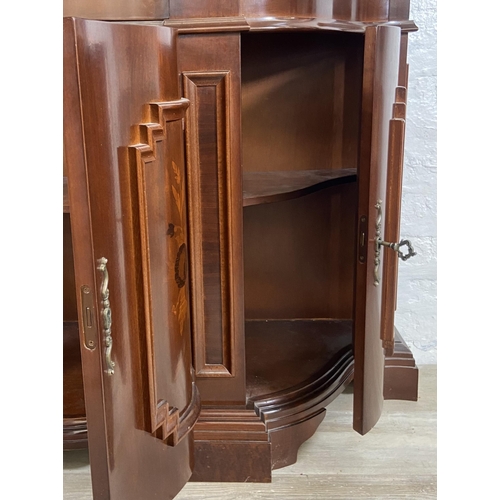 179 - An Italian style inlaid mahogany bow fronted display cabinet with three lower cupboard doors, three ... 