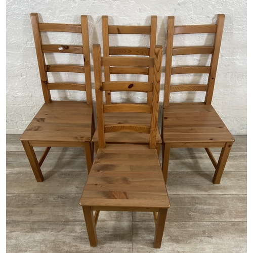 180 - A set of four pine ladderback dining chairs