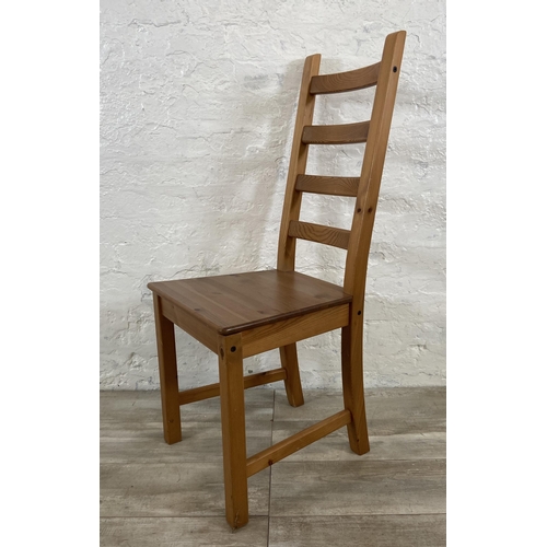 180 - A set of four pine ladderback dining chairs