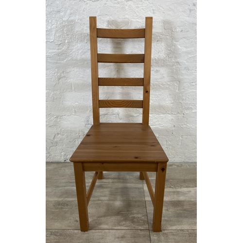 180 - A set of four pine ladderback dining chairs