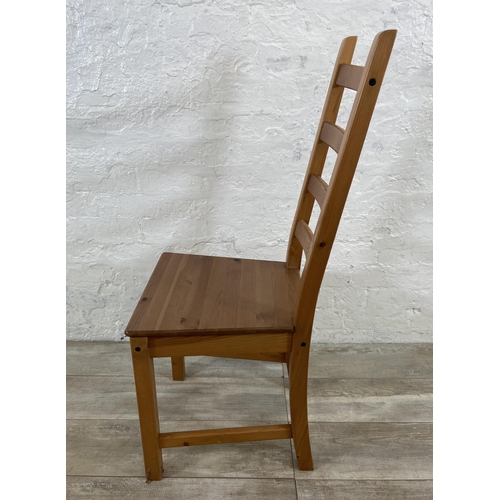 180 - A set of four pine ladderback dining chairs