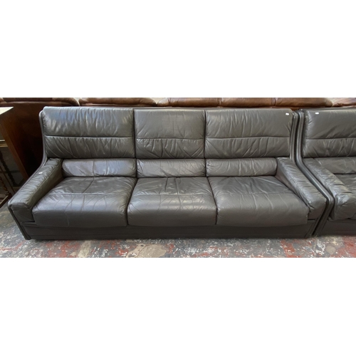 194 - A 1970s Gimson Slater Collection brown leather three piece lounge suite comprising three seater sofa... 