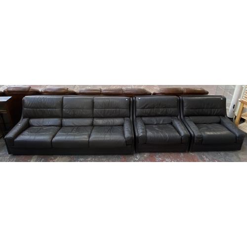 194 - A 1970s Gimson Slater Collection brown leather three piece lounge suite comprising three seater sofa... 