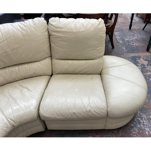 183 - A cream leather three seater corner sofa