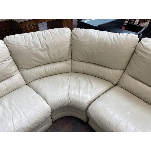 183 - A cream leather three seater corner sofa