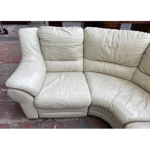 183 - A cream leather three seater corner sofa