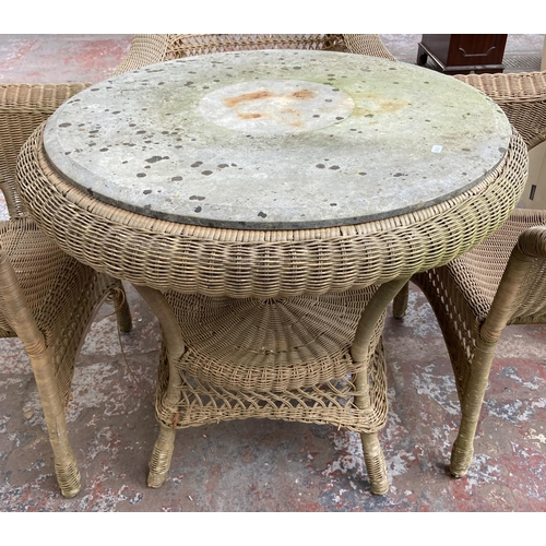 184 - A circular wicker two tier conservatory table with four chairs