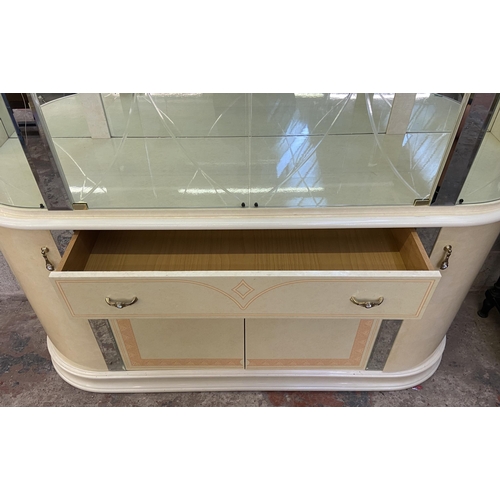 21 - An Italian Eddi Rose high gloss mirror back display cabinet - approx. 215cm high x 164 wide x 47cm d... 