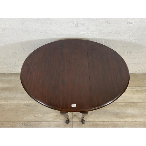 28 - A Georgian style mahogany drop leaf gate leg oval occasional table on cabriole supports - approx. 62... 