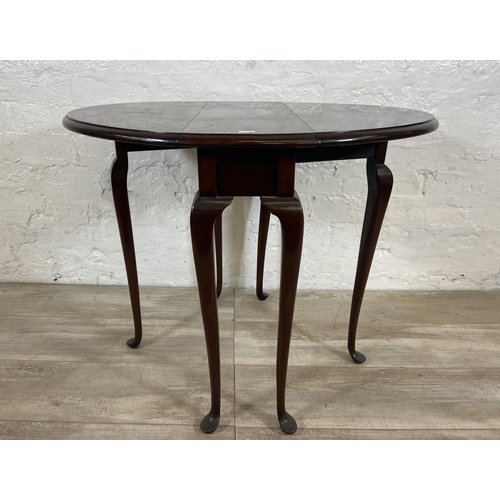 28 - A Georgian style mahogany drop leaf gate leg oval occasional table on cabriole supports - approx. 62... 