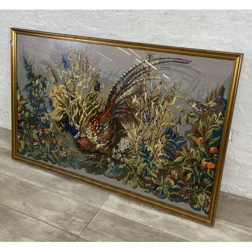 34 - A gilt framed pheasant tapestry - approx. 86cm high x 132cm wide