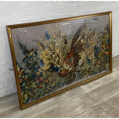 34 - A gilt framed pheasant tapestry - approx. 86cm high x 132cm wide