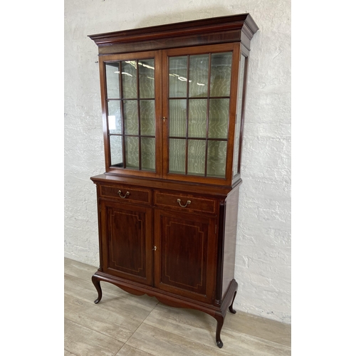 37 - An Edwardian inlaid mahogany bookcase on cabriole supports - approx. 177cm high x 91cm wide x 37cm d... 